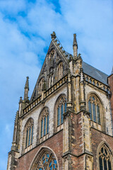 Fototapeta na wymiar Exterior of tower of the Saint Bavo church in Haarlem, Noord-Holland, The Netherlands, Europe