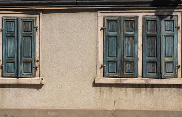 View of a typical old house facade with closed shutters in summer in Rhineland-Palatinate/Germany