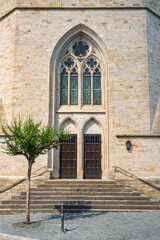 Fototapeta na wymiar View towards the entrance portal of the Evangelical Church in Flonheim/Germany in Rhineland-Palatinate