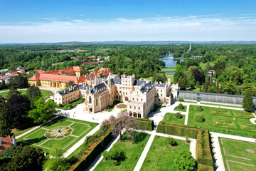 Fototapeta na wymiar Lednice Chateau extra wide panorama aerial photography with garden and park on summer day. Lednice - Valtice landscape, Czech South Moravia region. World Heritage Site.
