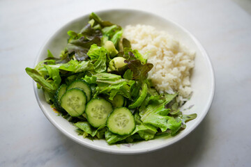 Healthy bowl. Green salad and rice. Top view