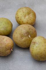 small potatoes going green and sprouting as result of incorrect storing