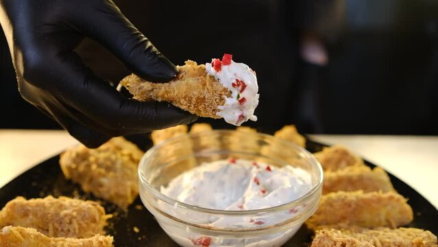 I dip a stick in breadcrumbs in white sauce