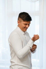 The man is dressed in a white shirt, cheerful mood. White background