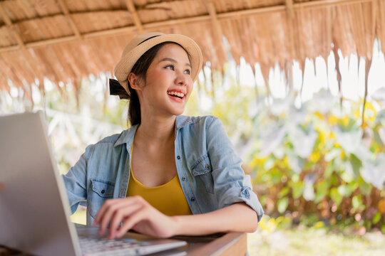 Asian Female Freelance Digital Normad Millennial Gen Y  Lifestyle Relax Casual Working With Laptop Outdoor At Balcony Near The Beach,asian Female Working Anywhere New Lifestyle Working While Travel