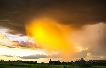 Spectacular storm with yellowish color, yellowish rain curtain