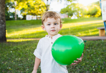 Little child playing with ball