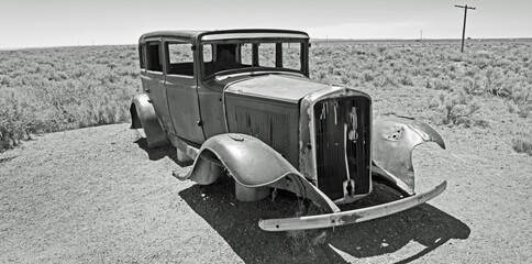Old abandoned car  on Route 66 in  the Arizona desert. . Left over from the 1930's dust bowl  route to California.
