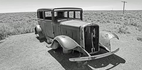 Poster Old abandoned car  on Route 66 in  the Arizona desert. . Left over from the 1930's dust bowl  route to California. © Tony Craddock