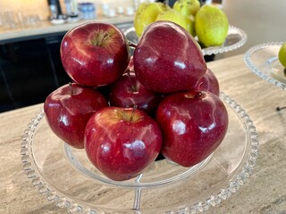 An apple is an edible fruit produced by an apple tree (Malus domestica). Apple trees are cultivated worldwide and are the most widely grown species in the genus Malus. 