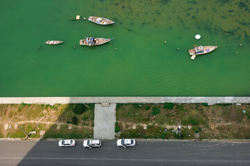 Aerial view of fishing boats and cars at Danang Bay, Son Tra peninsula, Danang city, Vietnam