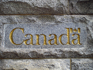 Canada sign on the stone wall