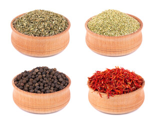 Mix of spices and seasonings in wooden bowl, isolated on white background. Dry organic herbs. Ingredient for cooking.