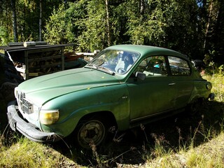 old car wreck in the forest near Tornio, Finland