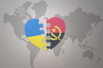 puzzle heart with the national flag of ukraine and angola on a world map background. Concept.
