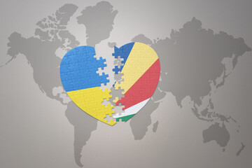 puzzle heart with the national flag of ukraine and seychelles on a world map background. Concept.