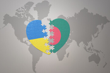 puzzle heart with the national flag of ukraine and bangladesh on a world map background. Concept.