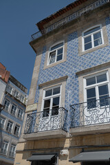 Obraz premium Facades of houses with tiles in the city of Porto in the summer of 2022.