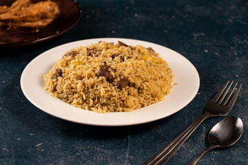 Traditional spicy indian Beef Biryani in a plate on marble background top view of pakistani pulao