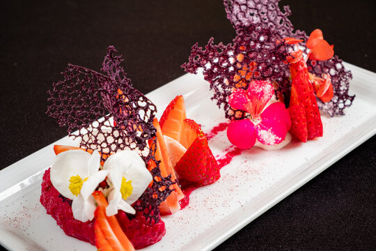 strawberry dessert wit edible flowers