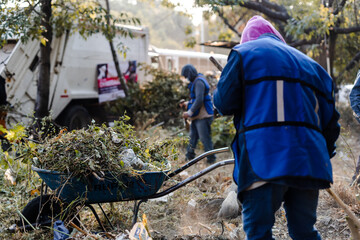 Neighbors carry out a clean-up day in a ravine in the city of Puebla