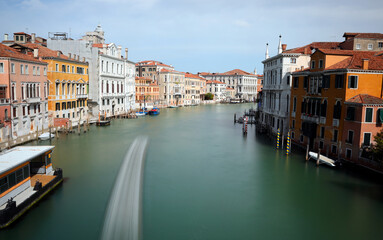 navigable canal and the wake left by the boat of the island of Venice in Italy photographed with long exposure time
