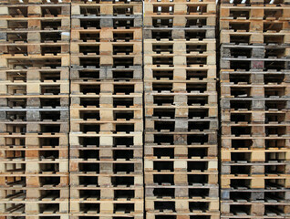 background of hundreds of wooden pallets in the warehouse of the freight forwarder