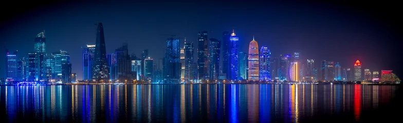 Gordijnen Doha skyline with many towers during the night. © MSM