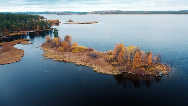Aerial view of the lake in Kola Peninsula in Russia. Flight over the lake in arctic area during autumn