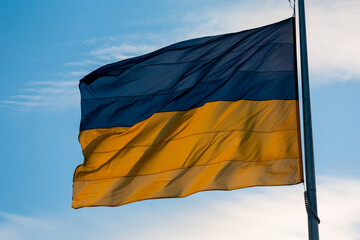 Ukrainian flag at the evening with sky on background