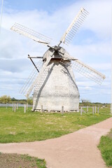 Old wooden windmill in the village of the country