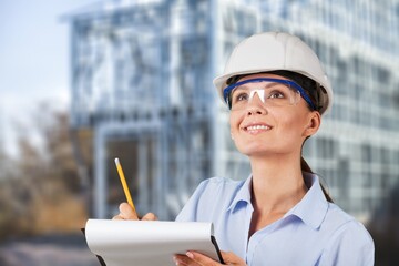 Woman engineer architect worker holding blueprint construction