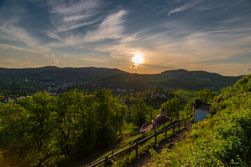Sunset near old buildings in Banska Stiavnica town in spring evening