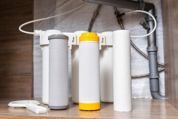 House water filtration system. Installation or replacement of water purification filters under...