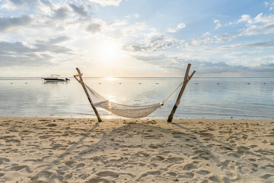 Hammock on the beach with sunset view