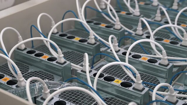 Advanced Technology Of Immersion Cooling Of Computers Mining Cryptocurrency In Liquid For High Efficiency In An Open Bath In A Server Room