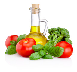 Bottle of olive oil, tomatoes and  broccoli with leaves basil isolated on white background