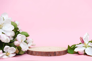 Wooden podium and white flowers on a pink background, mockup