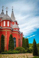Fototapeta na wymiar Orthodox church painted in red . Monastery of village Zloti, Causeni from Moldova, monastery