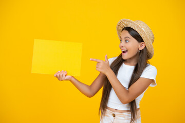 amazed teen girl point finger on empty advertisement paper with copy space