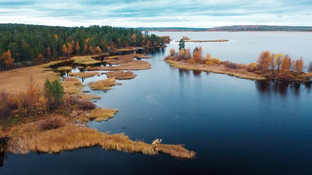 Aerial view of the lake in Kola Peninsula in Russia. Flight over the lake in arctic area during autumn