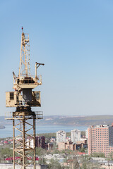 crane at construction site panorama of city. unfinished building, building under construction. panorama of city, construction of high-rise building russia