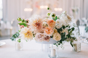 Dinner table decorated by candles and flowers. Wedding. Decor