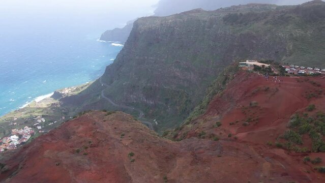 Aerial view of stunning viewpoint Mirador de Abrante with glass observation balcony above Agulo village in La Gomera island. Restaurant on red clay