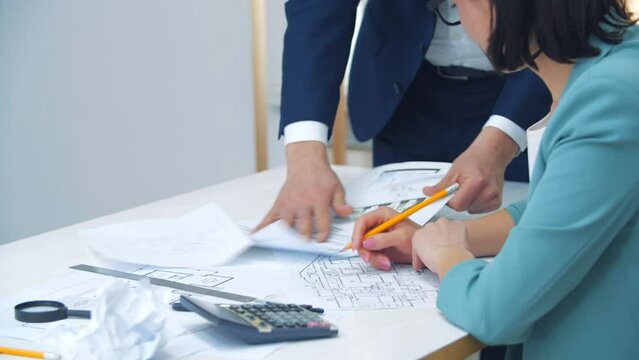 4k slow motion video of close up engineer hand sketching a construction project.