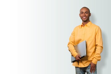 Happy Guy With Laptop Sitting On Floor  Cheerful Man Using PC Computer and Relaxing