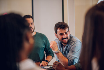 Group of colleagues having a meeting in the office