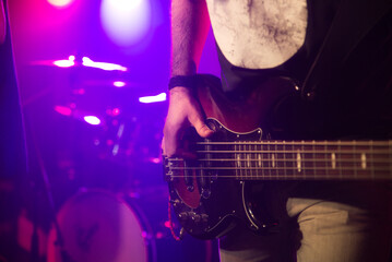 Bassist playing the bass on stage for background, live music, live event, music around the world