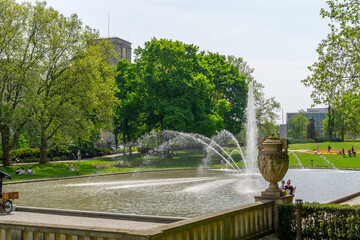 City of Poznań, Summer, Mickiewicz Park with a fountain and green trees, plane trees.