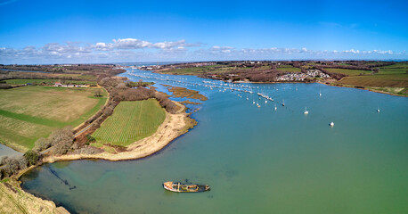 Panaramic aerial landscape image of River Median with Cowes in the background on a sunny day